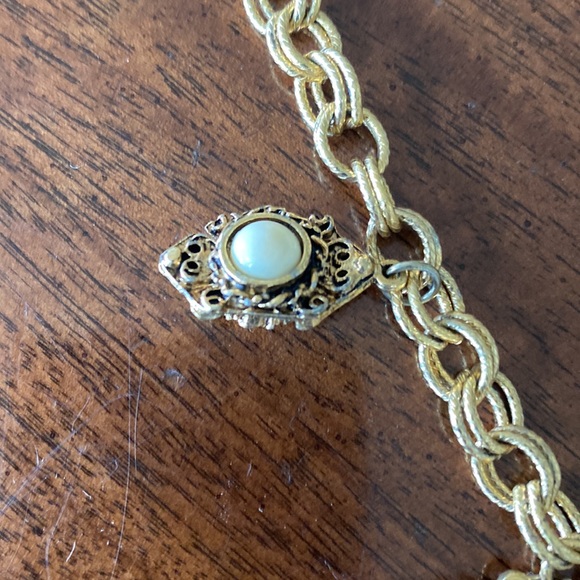 Gold tone charm necklace. Adjustable length. Great condition. - Picture 4 of 10